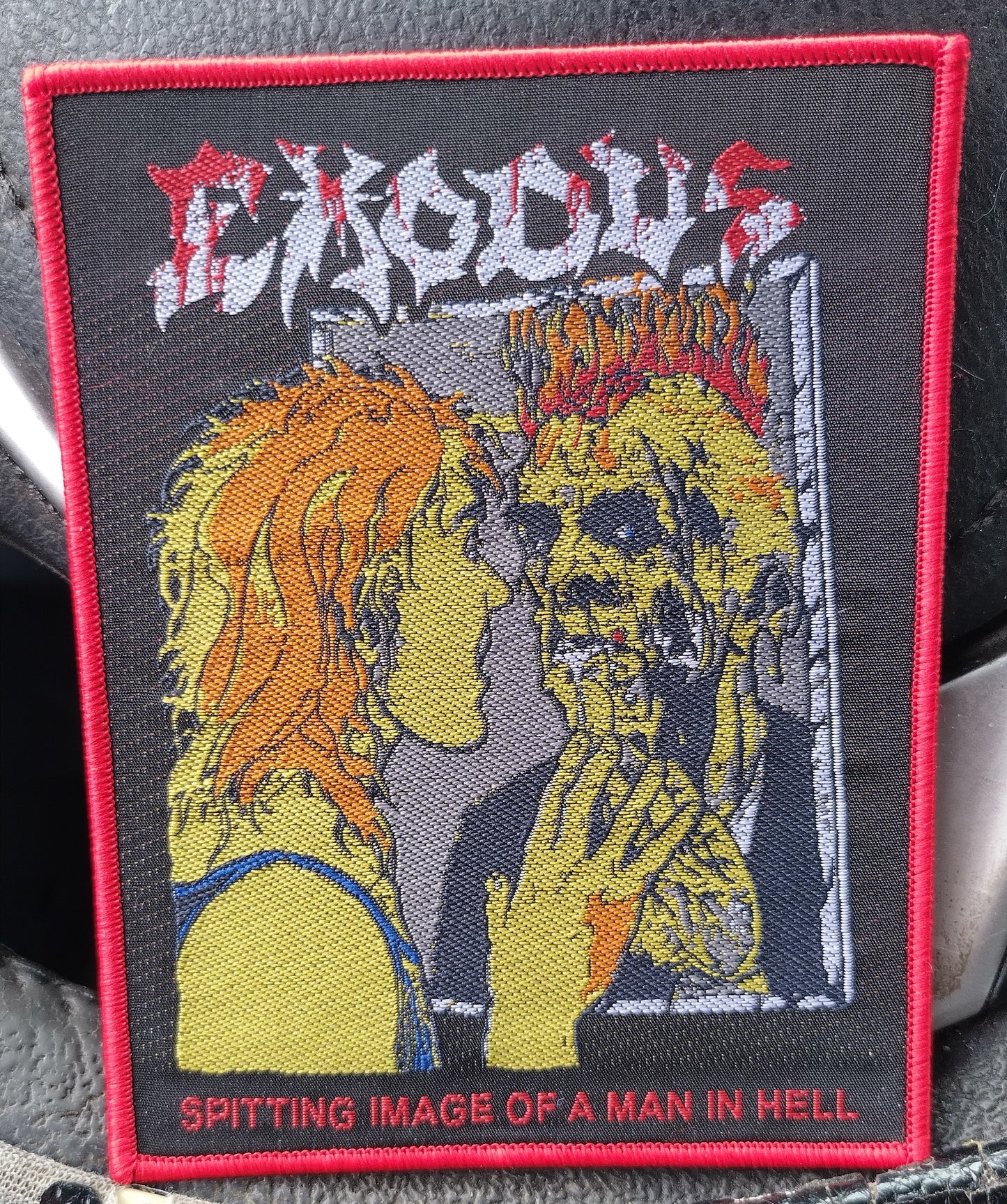 Exodus spitting image of a man in hell Red border Woven Patch