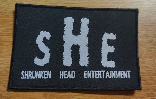 Shrunken Head Ent logo Black border Woven Patch