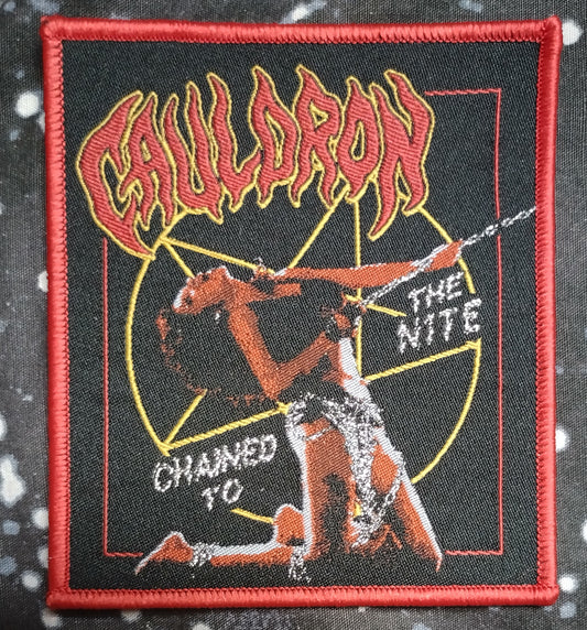 Cauldron chained to the nite Burgundy border Woven Patch.